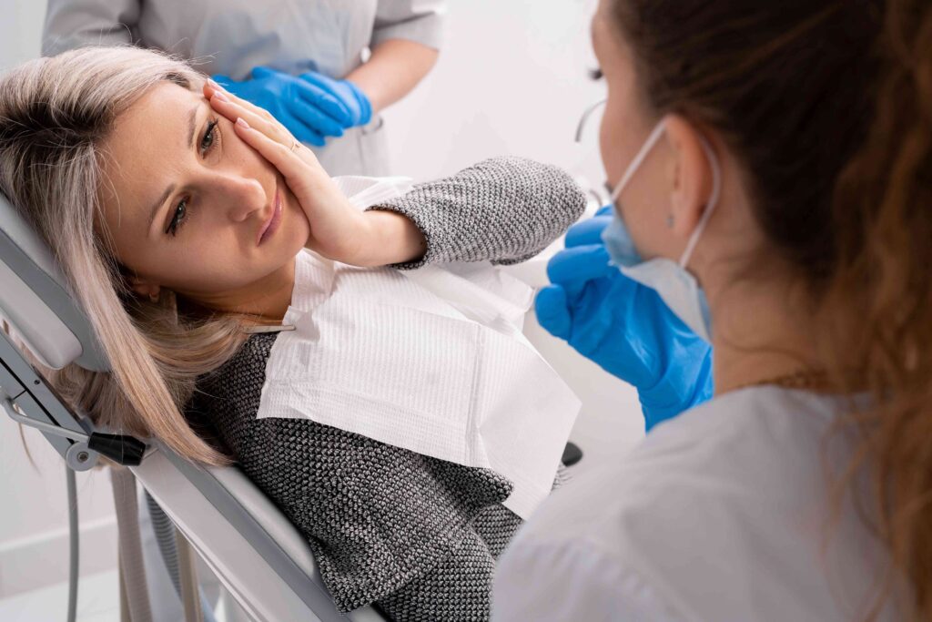 Woman at the dentist with a toothache 